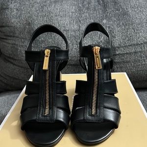 Michael Kors, women’s Damita black leather sandals.